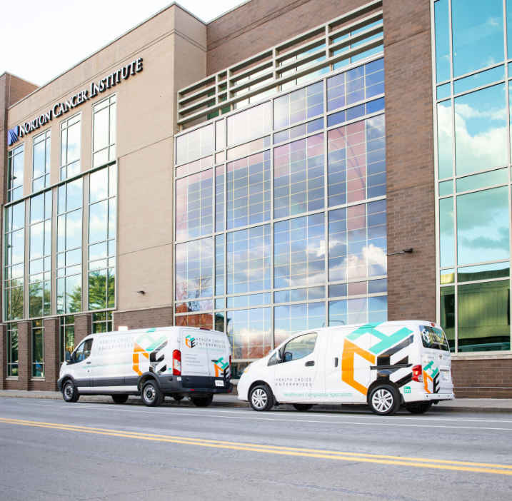 Health Choice Enterprises vans parked outside of Norton Cancer Institute.